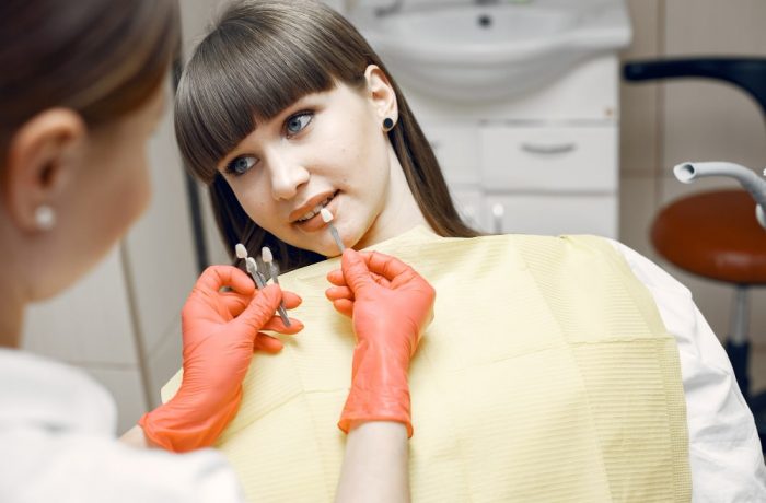 woman-dental-chair-girl-chooses-implant-bbeauty-treats-her-teeth-min